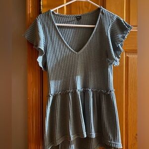 Large, dusty blue blouse